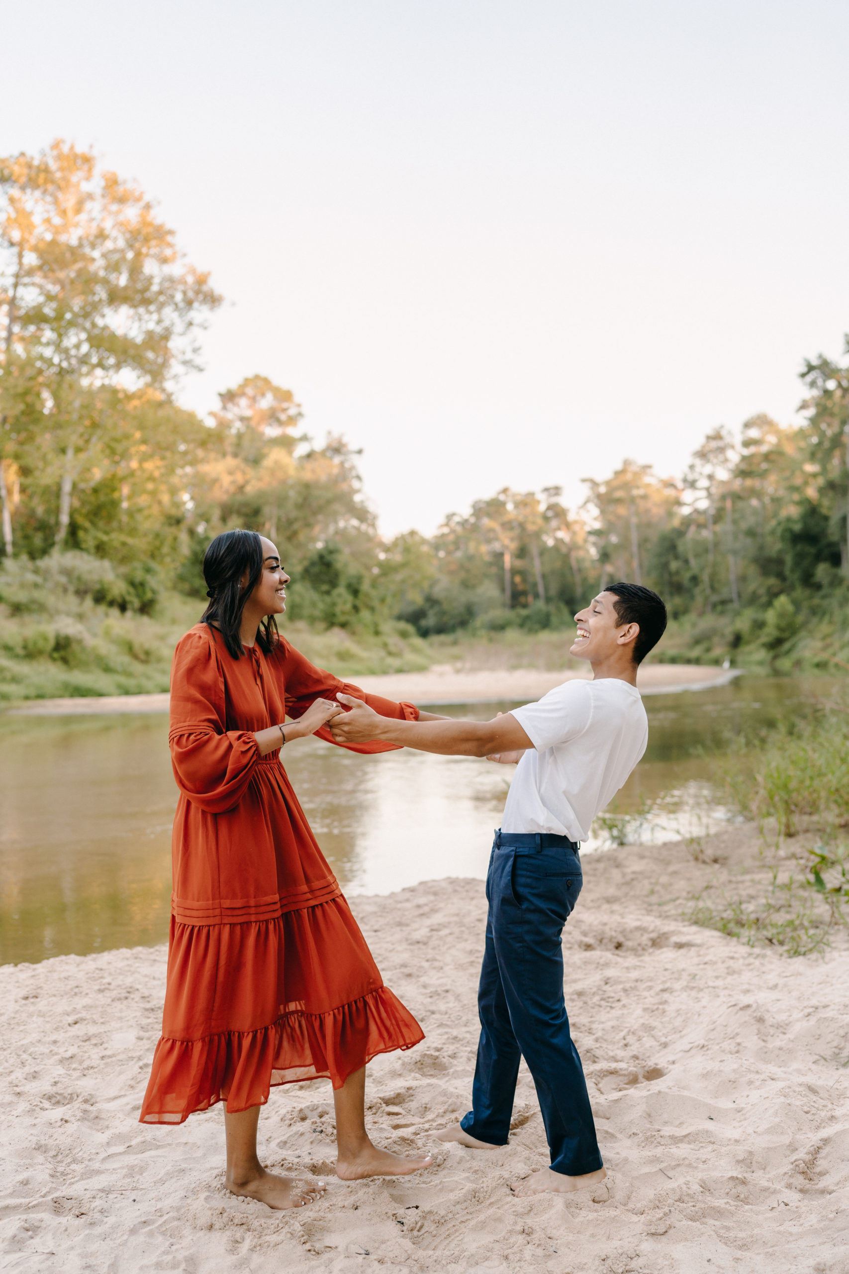 A couple dancing for their engagement session done by Angelina Loreta Photography in Houston