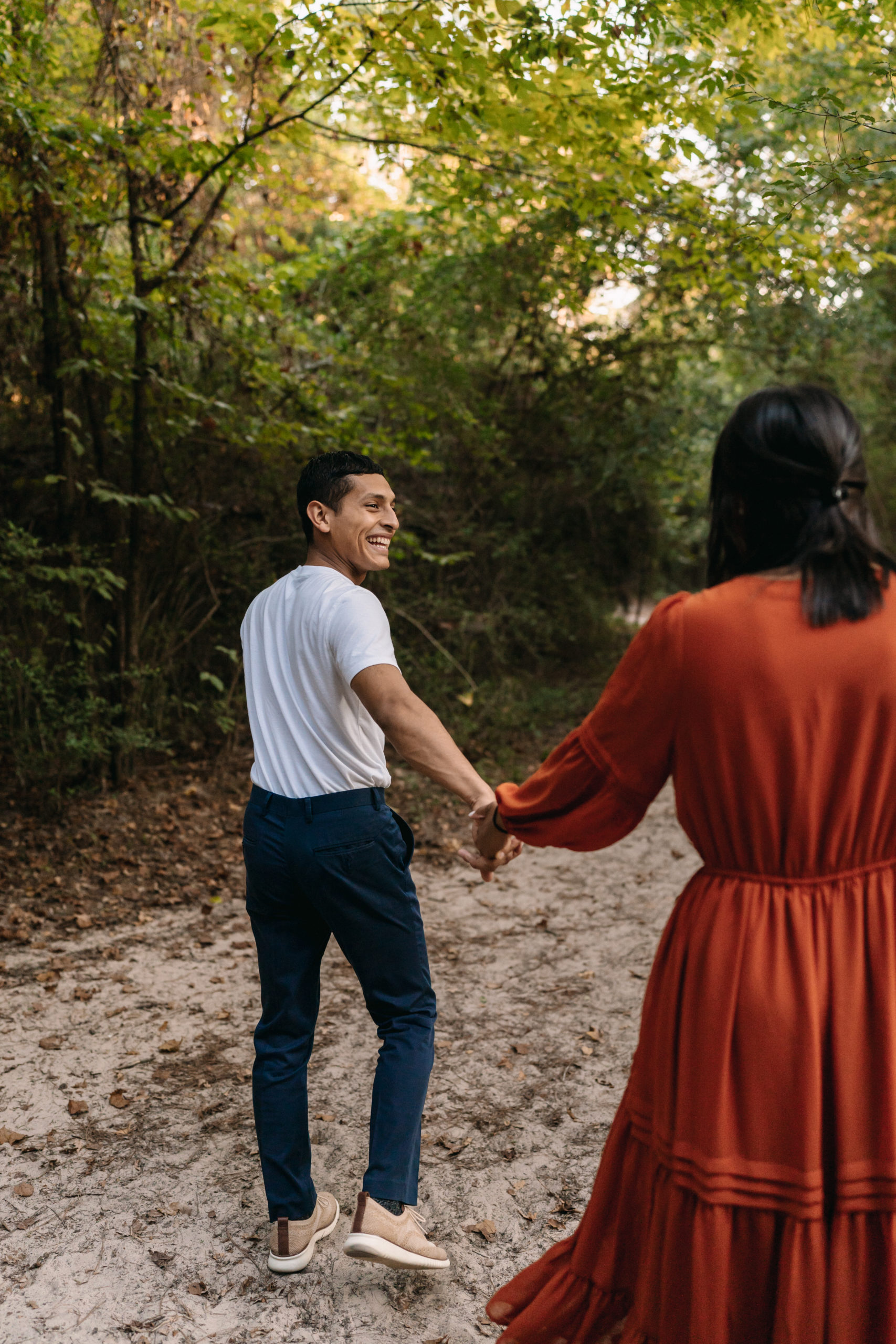 A Couple holding hands at their engagement session done by Angelina Loreta Photography