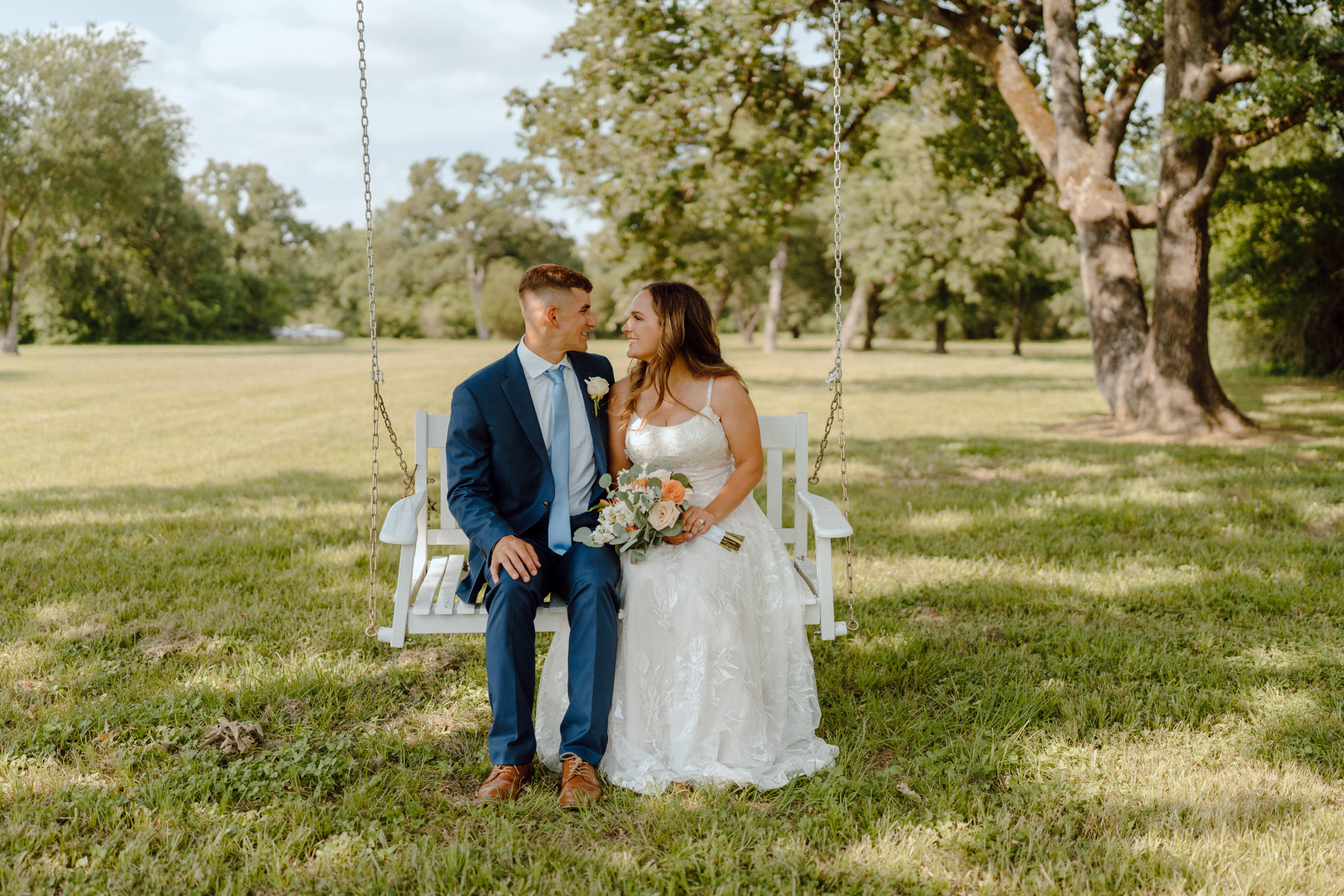 This timeless backyard wedding took place in the gorgeous Texas hill country. While the stunning venue held well over 200 guests, this beautiful Texas wedding had the charm and feel of an intimate backyard wedding. Each photo is full to the brim with candid storytelling in an editorial style. Angelina Loreta Photography created timeless wedding photos for the Austin couple.