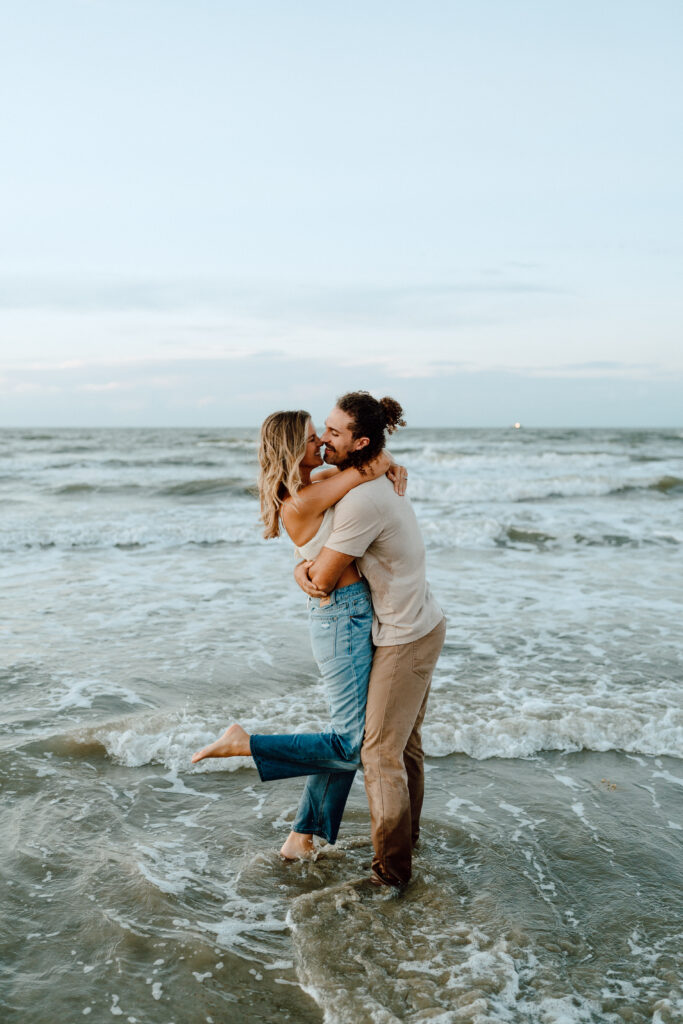 This sunrise adventure session is the perfect picture of whimsical love! The blue hour featured in Galveston beach made for the most dreamy couples session ever! The neutral, casual outfits worn made for a fun, personality filled photos. Angelina Loreta Photography serves adventurous couples ready to go to epic places for dreamy photos.