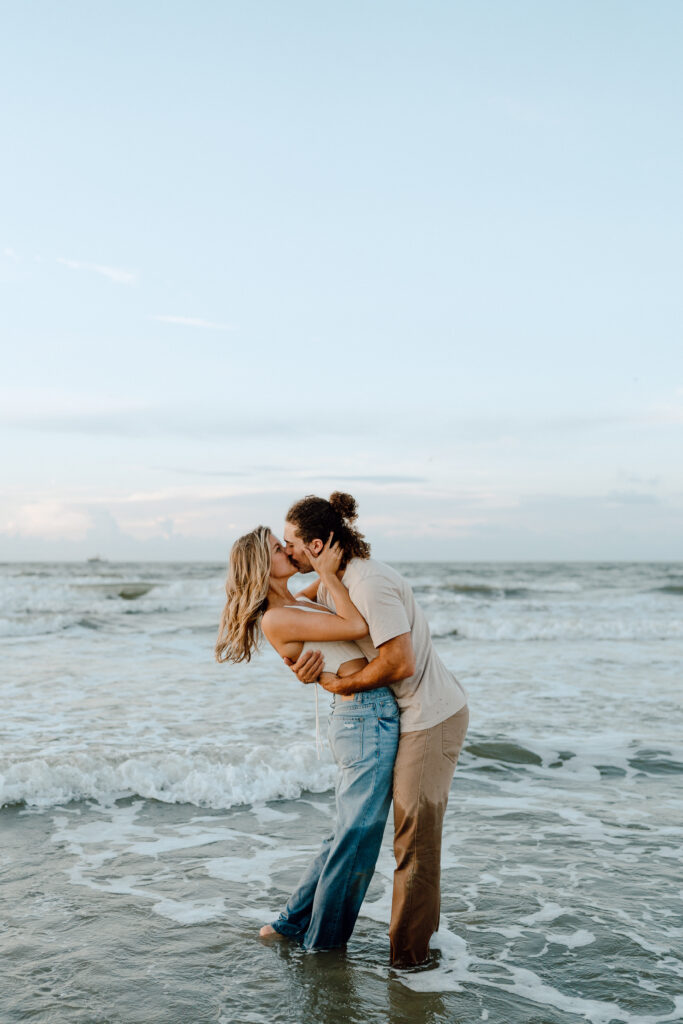 This sunrise adventure session is the perfect picture of whimsical love! The blue hour featured in Galveston beach made for the most dreamy couples session ever! The neutral, casual outfits worn made for a fun, personality filled photos. Angelina Loreta Photography serves adventurous couples ready to go to epic places for dreamy photos.