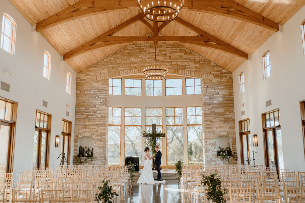 This first look was among the most intimate moments of Katie and Luke's wedding day. The Texas couple got married at the timeless chapel at Canyonwood Ridge, full of natural light. Angelina Loreta Photography created personality filled photos for this down to earth couple in Austin, Texas.