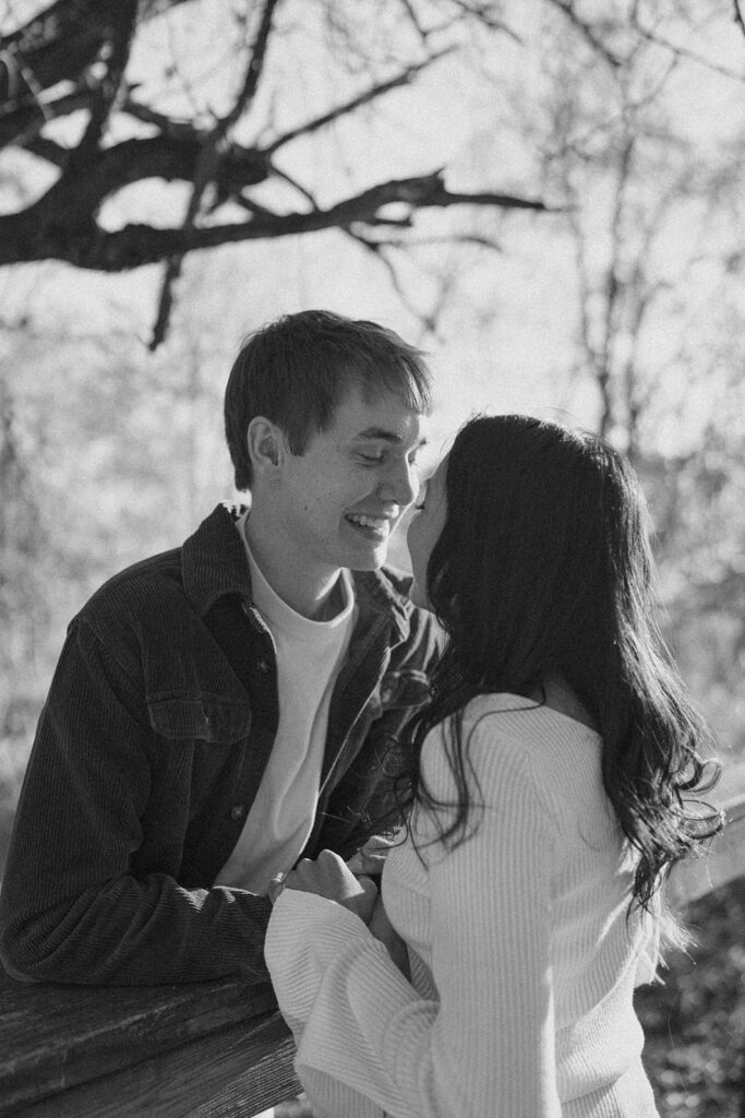 romantic and candid engagement photos couple smiling and holding hands