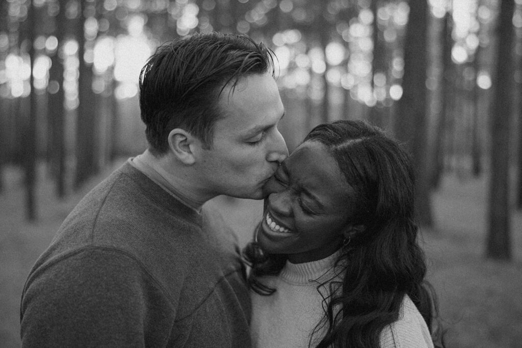 black and white engagement photos playful and candid
