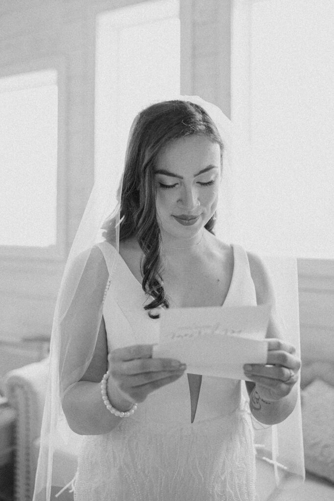 candid and romantic getting ready photos bride reading letter