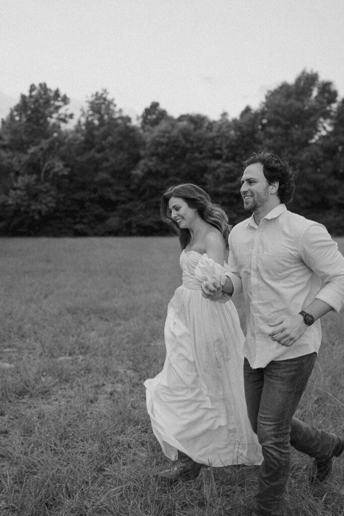 black and white film inspired couple running photos