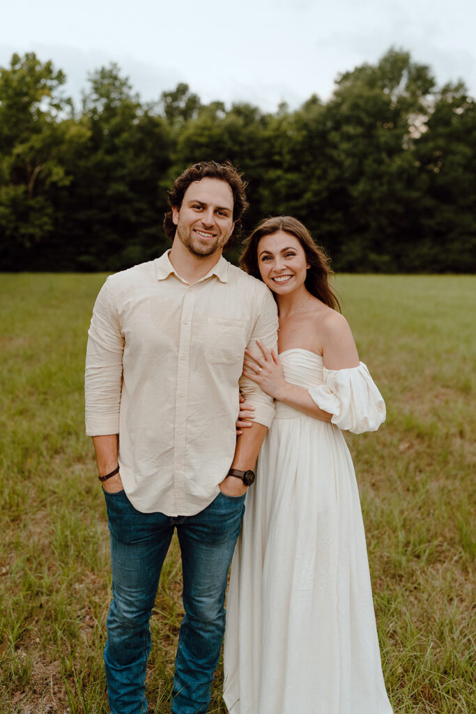 couple smiling in open field in texas