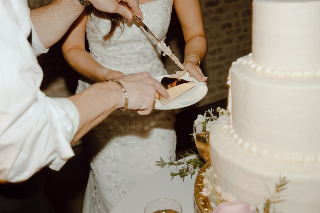 bride and groom cutting cake for texas wedding flash wedding reception photos