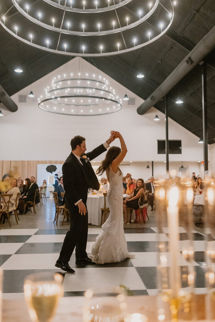 indoor wedding reception texas barn wedding venue first dance with bride and groom