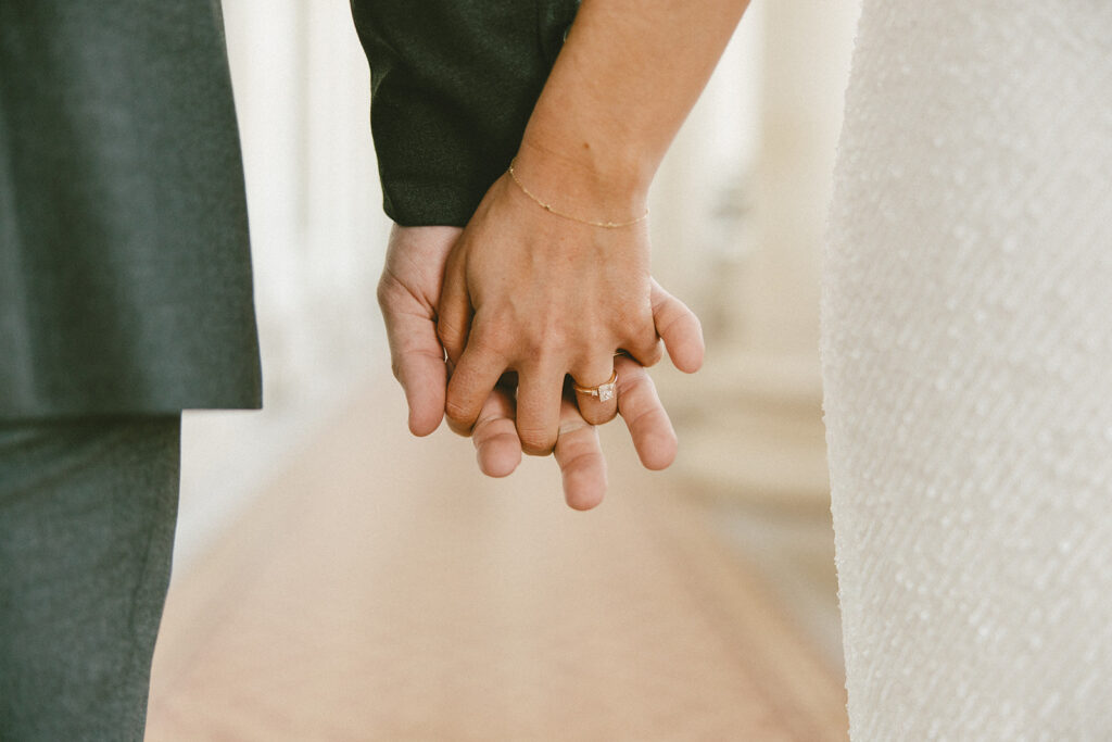 wedding ring photos bride and groom holding hands