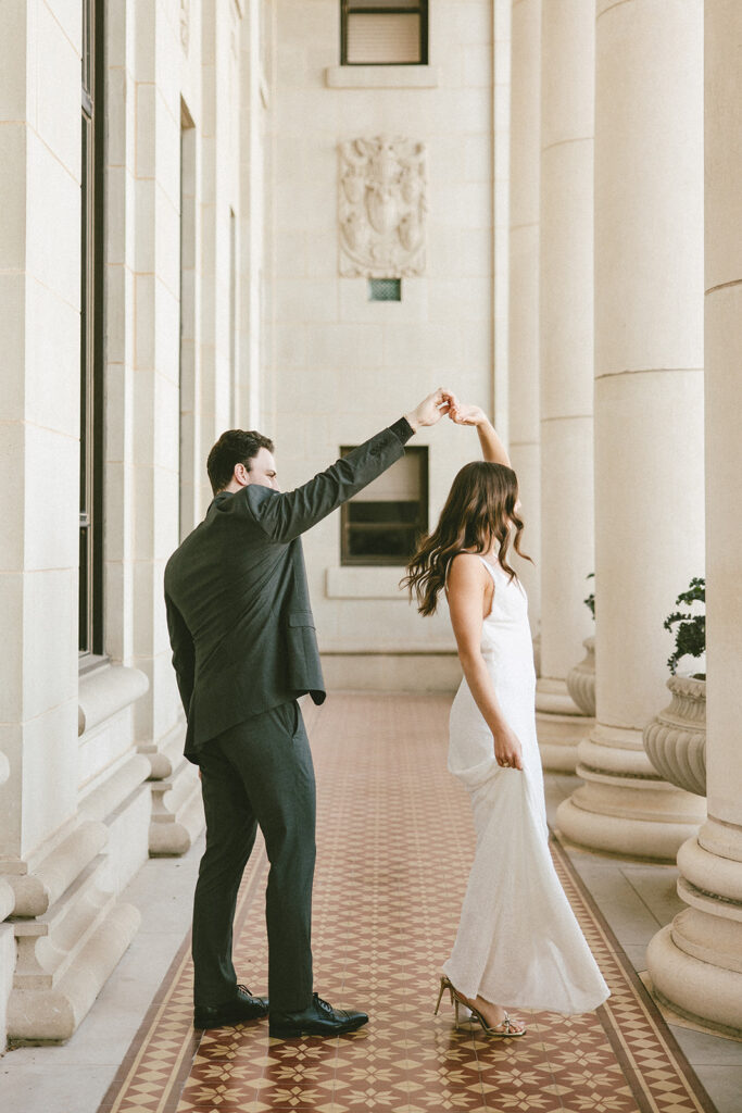 bride and groom candid spinning pose