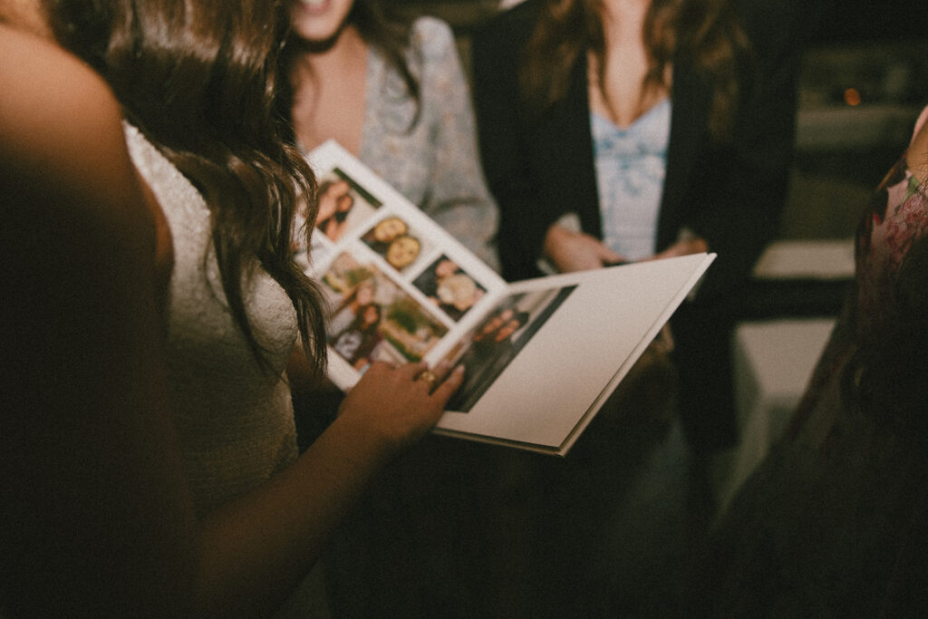 bride looking at photo album