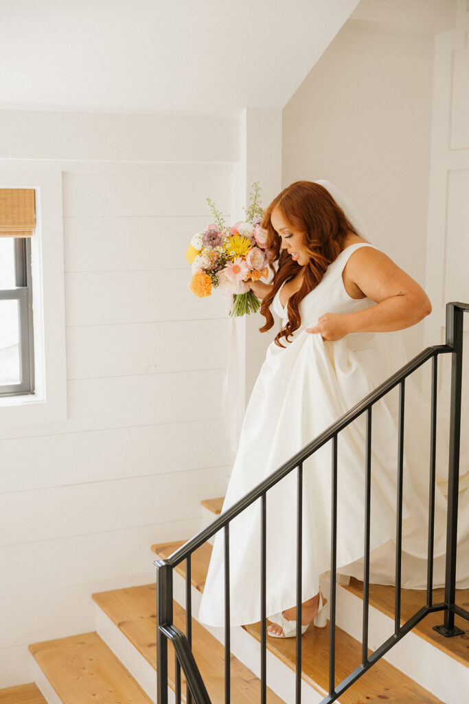 bride walking down stairs candid moments