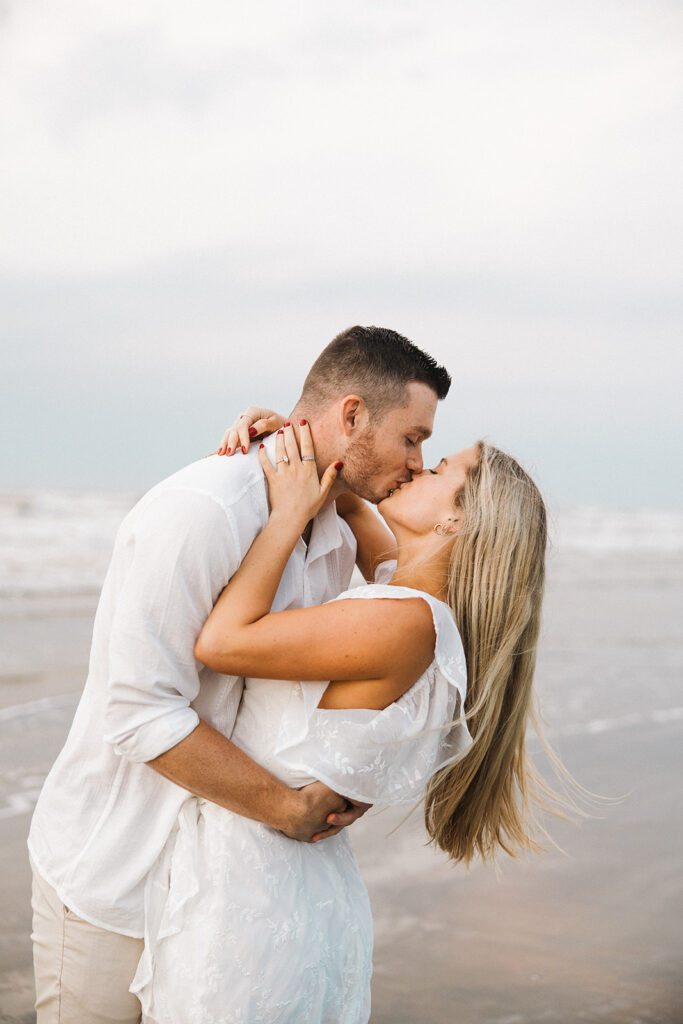 couple kissing romantic engagement photo poses