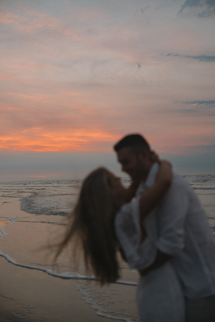 sunset beach engagement photos documentary-style engagement photos