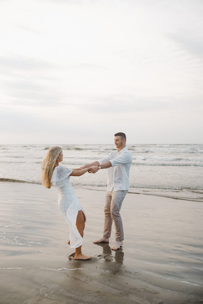 documentary-style engagement photos couple spinning