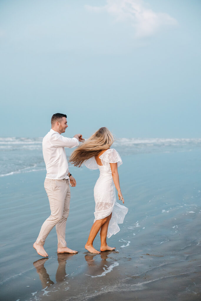 documentary-style engagement photos in texas on the beach