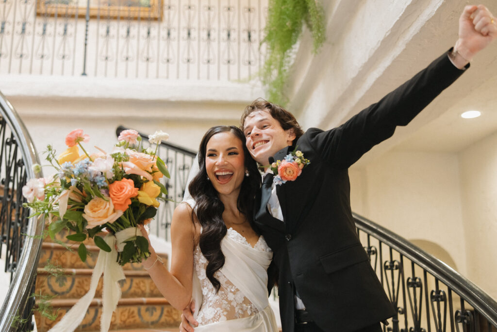 bride and groom celebrating marriage after ceremony