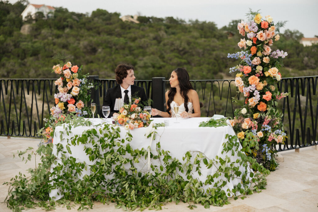 bride and groom at wedding reception table