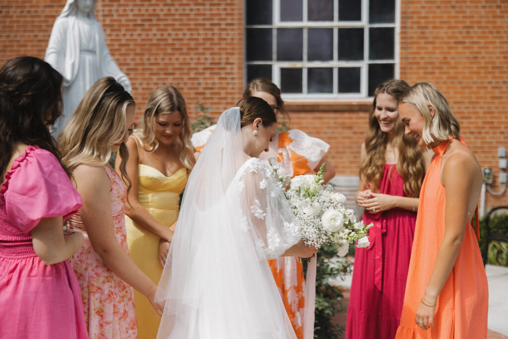 bridesmaids with bride outdoor portraits