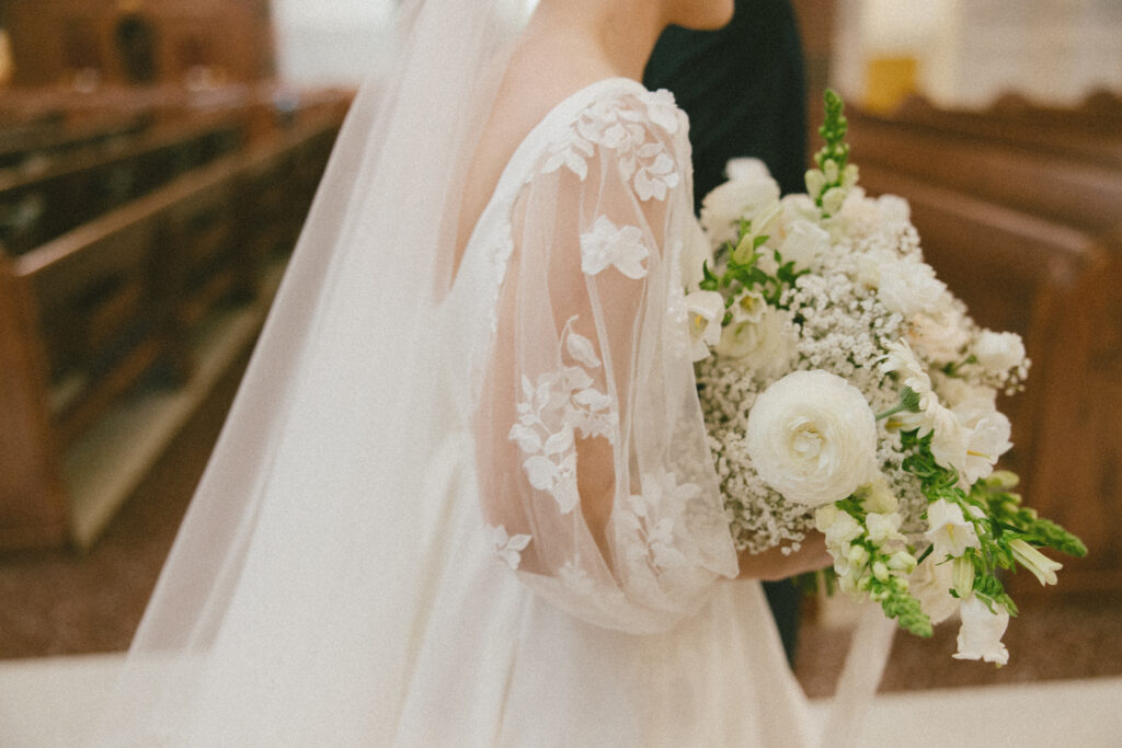 white bridal bouquet bride walking down the aisle photos