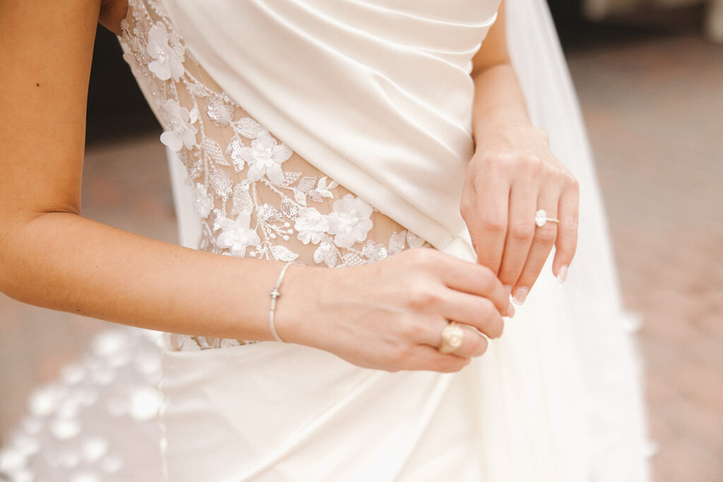 detail shots of wedding dress and rings bride