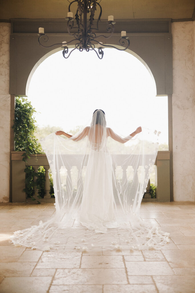 bride looking off into the distance at texas wedding venue