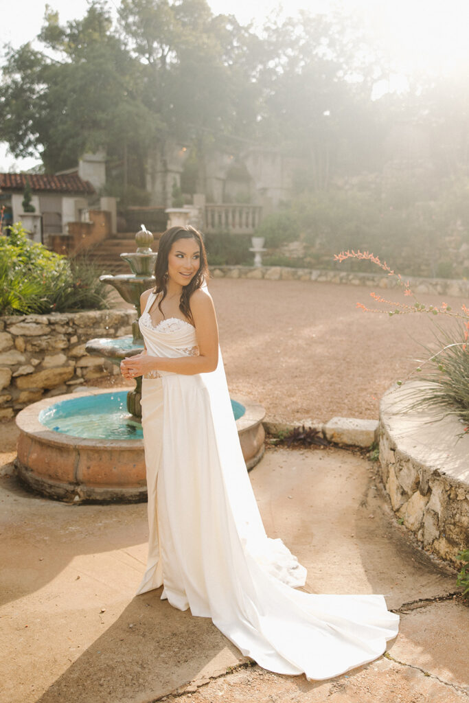 bride in front of modern elegant fountain in texas