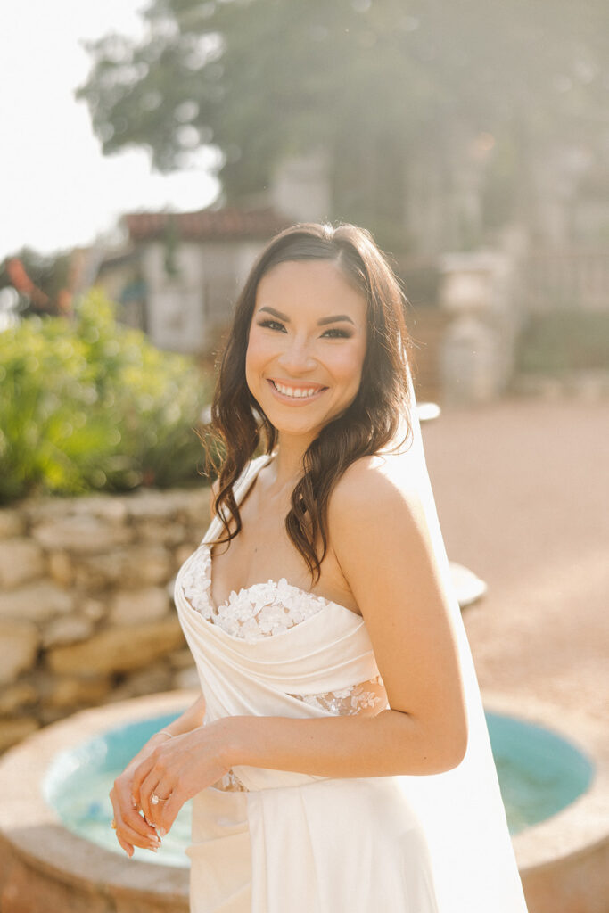 bride in front of modern elegant fountain in texas