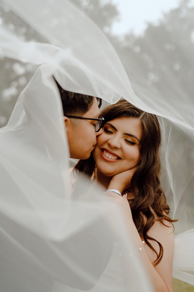 under the veil bride and groom photos