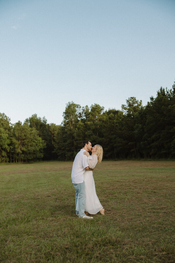 cinematic couples photoshoot running in a field