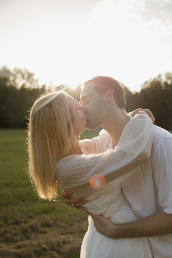 cinematic couples photoshoot running in a field