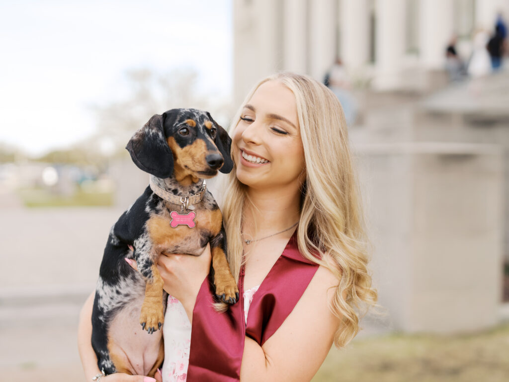 college senior smiling in her cap and gown
