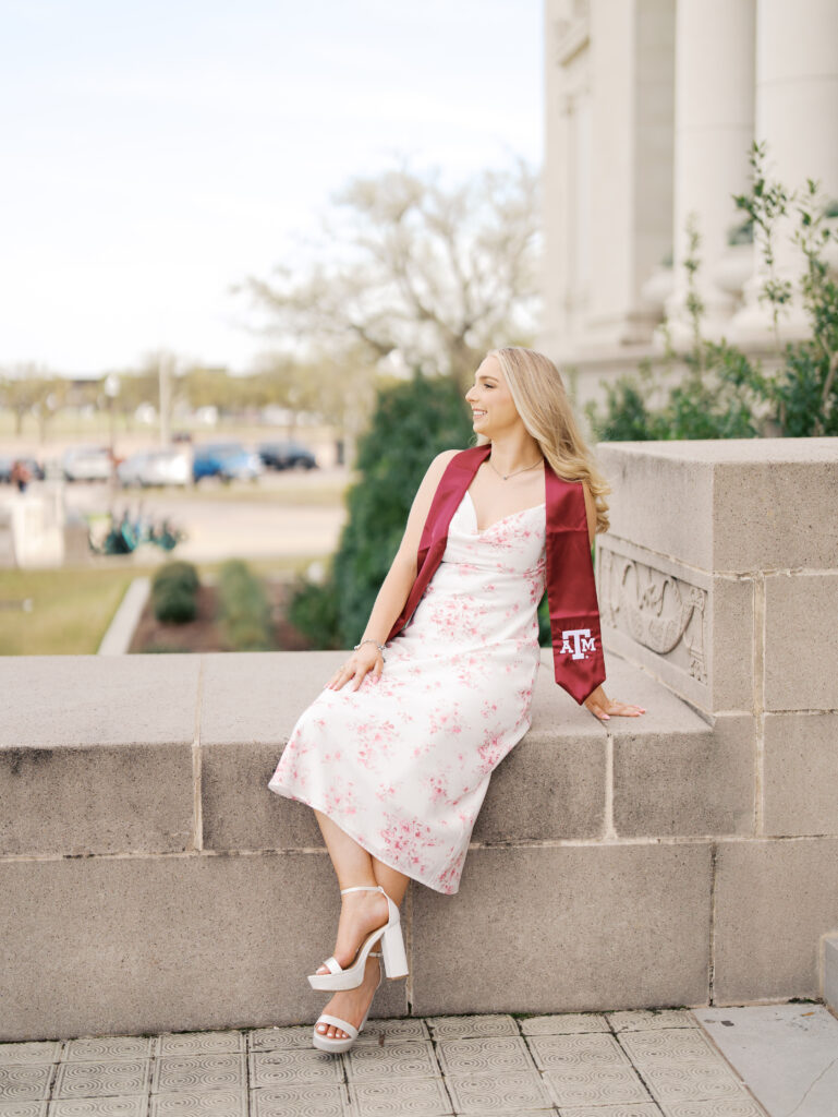 college senior smiling in her cap and gown
