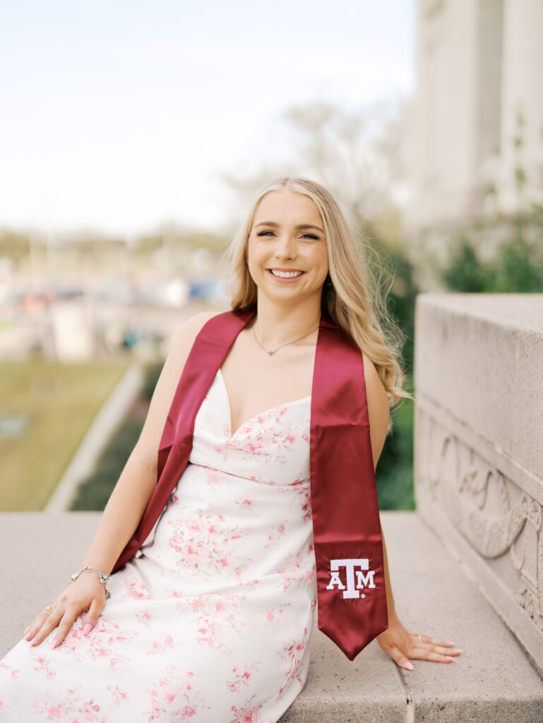 college senior smiling in her cap and gown