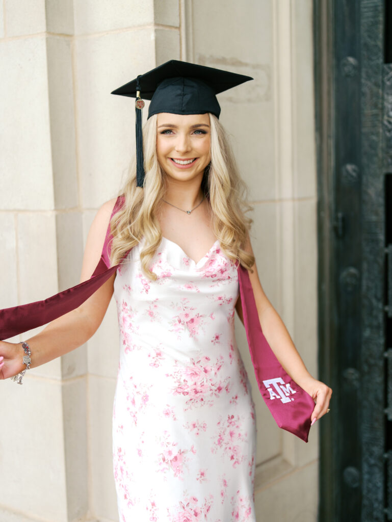 college senior smiling in her cap and gown