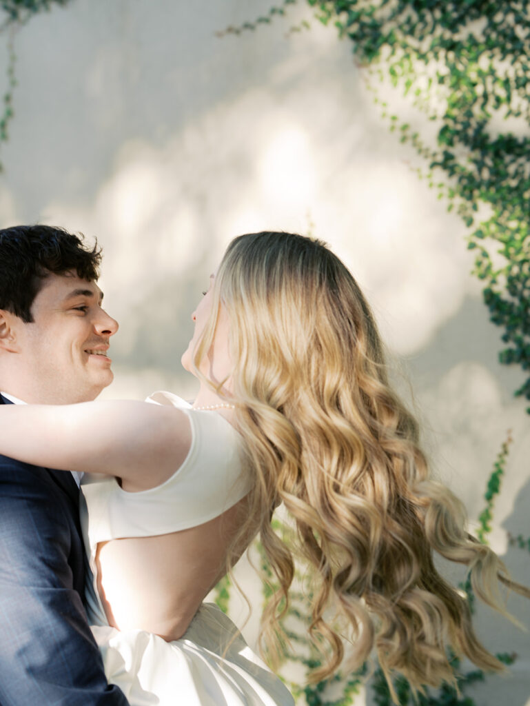 couple smiling and laughing during photoshoot in texas