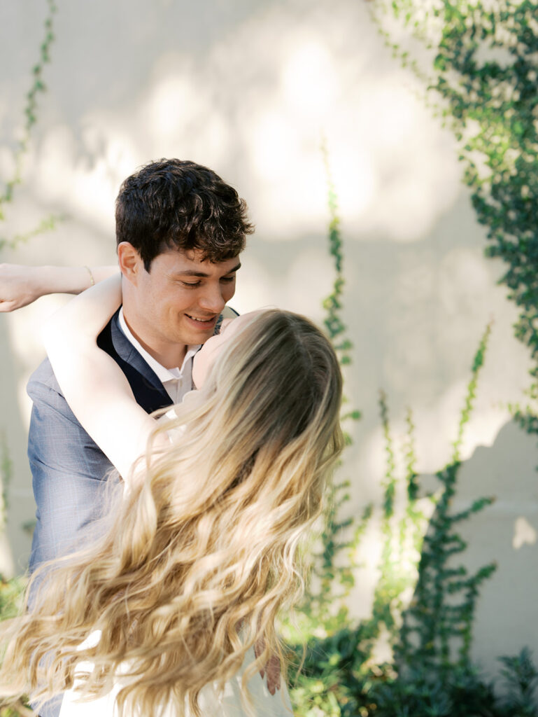 couple smiling and laughing during photoshoot in texas