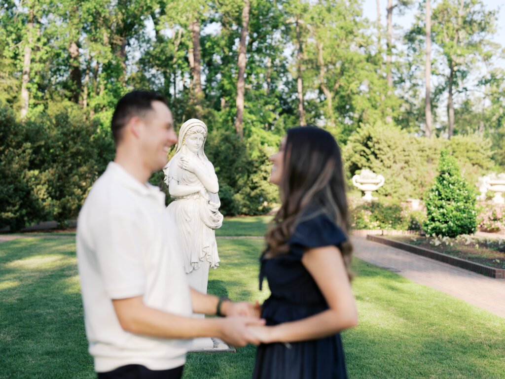 couple smiling at each other for couples photoshoot