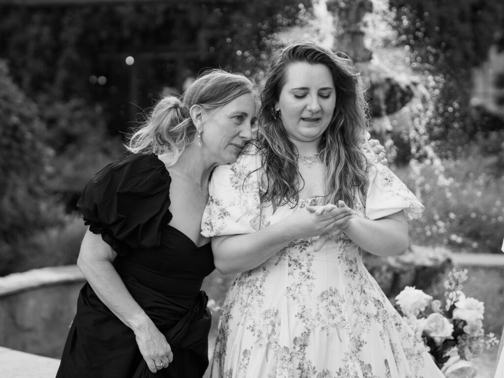 showing off engagement ring to mom and sister
