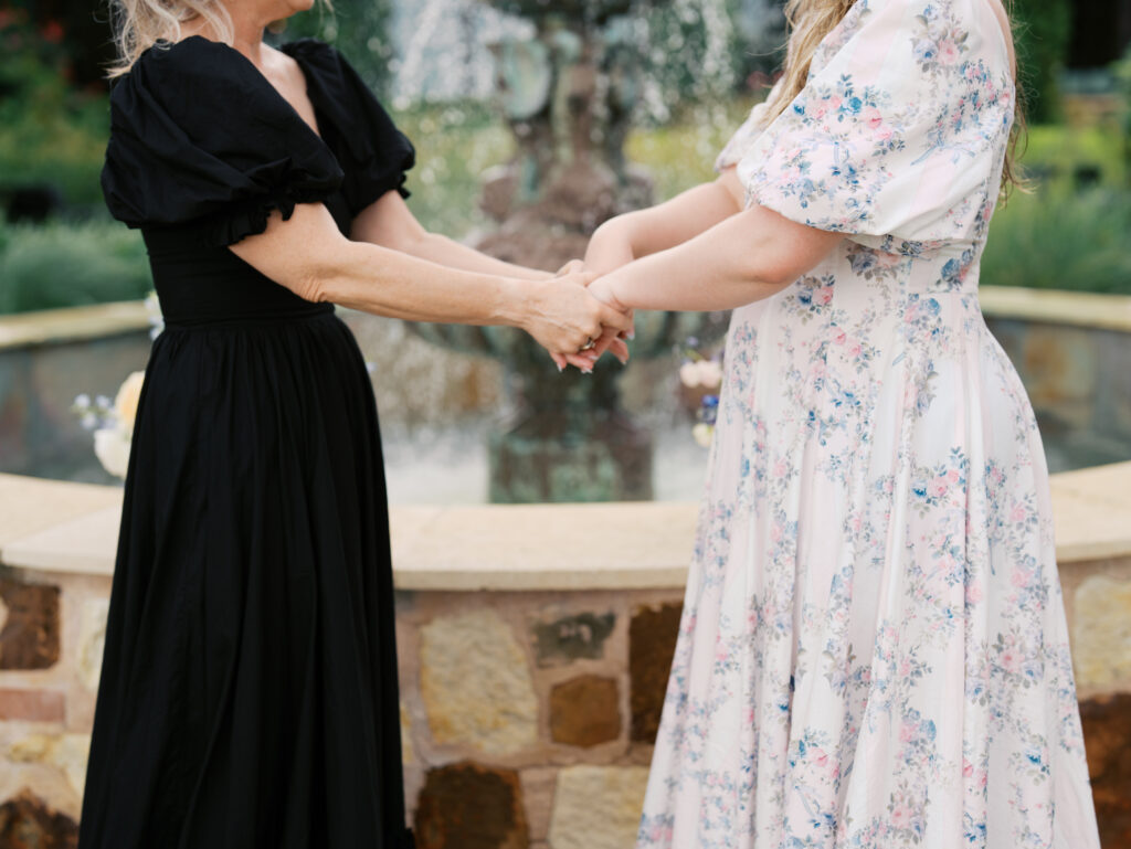 showing off engagement ring to mom and sister