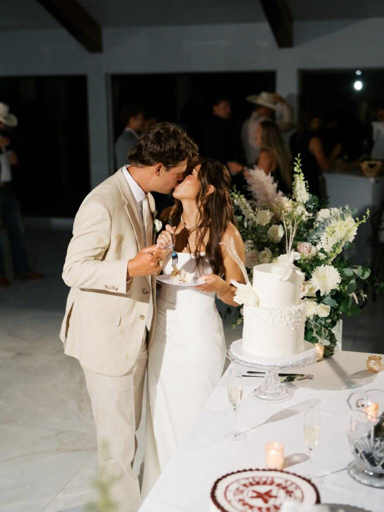 bride and groom cutting the cake