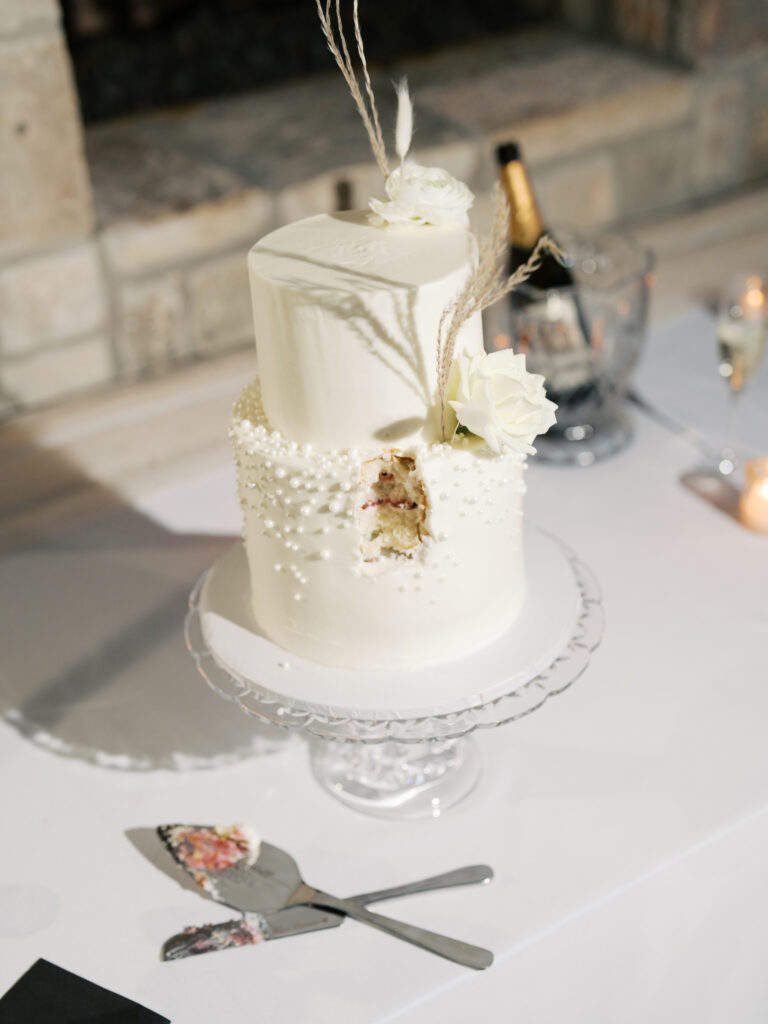 bride and groom cutting the cake