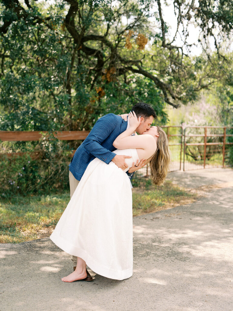 couple kiss pose outdoors