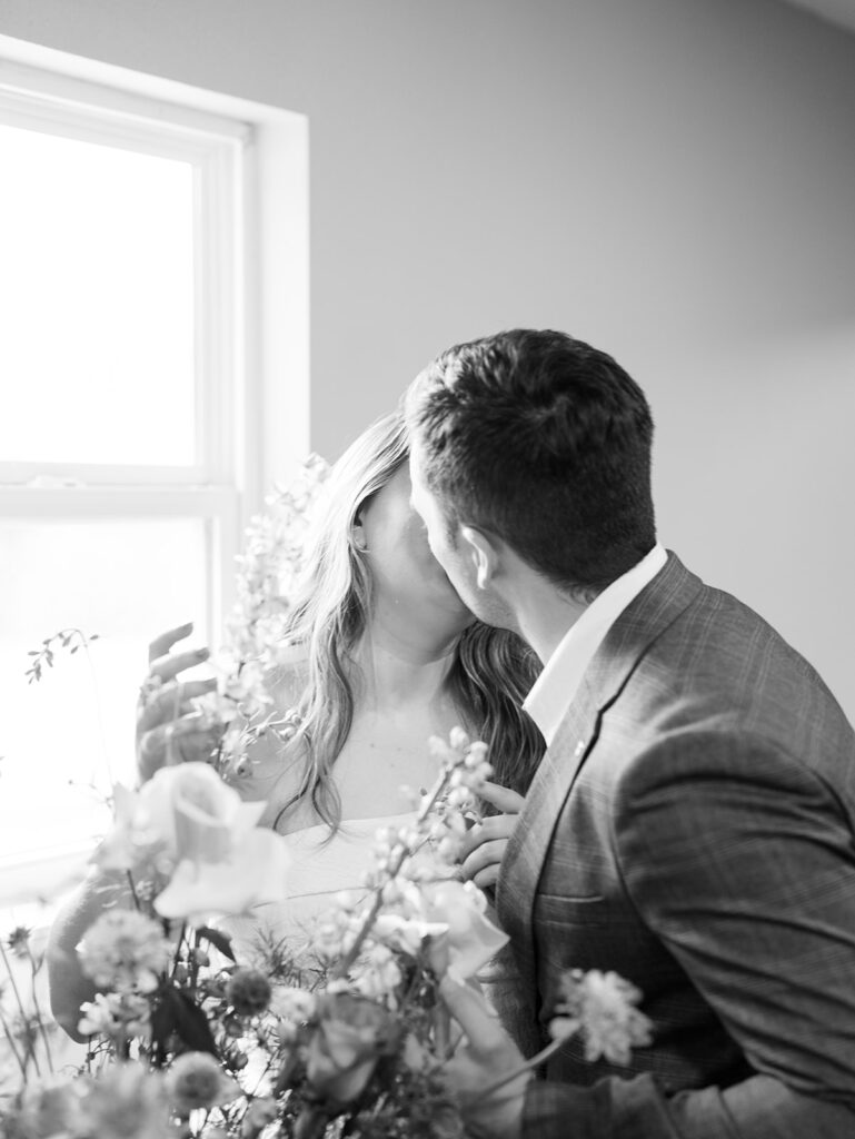 couple kissing for romantic engagement session