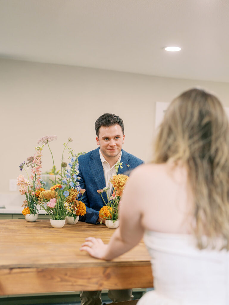 couple smiling at each other during engagement session