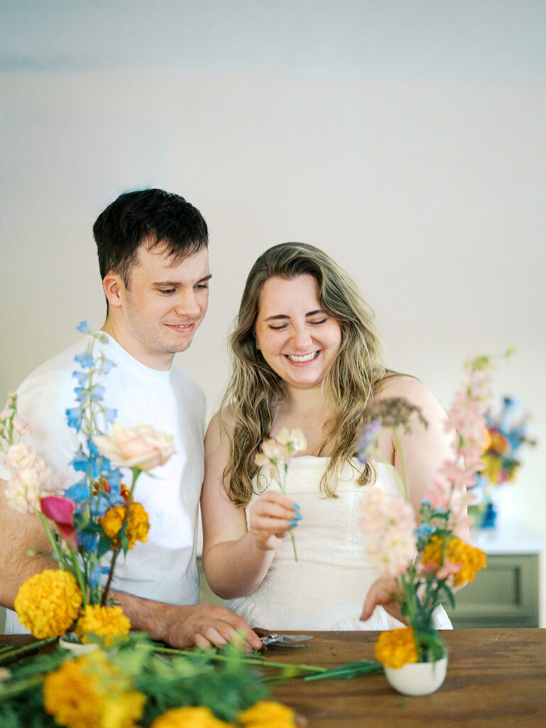 romantic engagement photos with floral arrangements studio engagement pictures