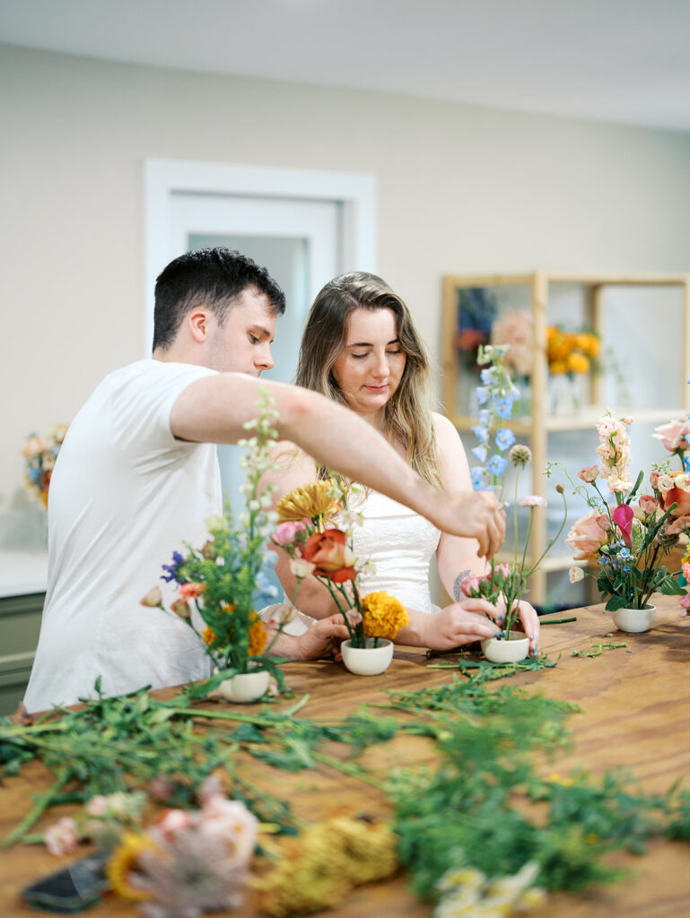 romantic engagement photos with floral arrangements studio engagement pictures