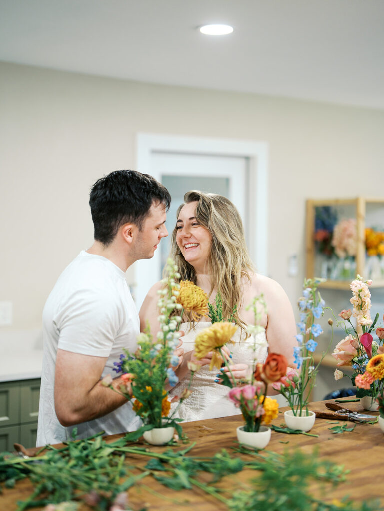 romantic engagement photos with floral arrangements studio engagement pictures