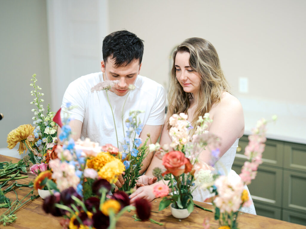 romantic engagement photos with floral arrangements